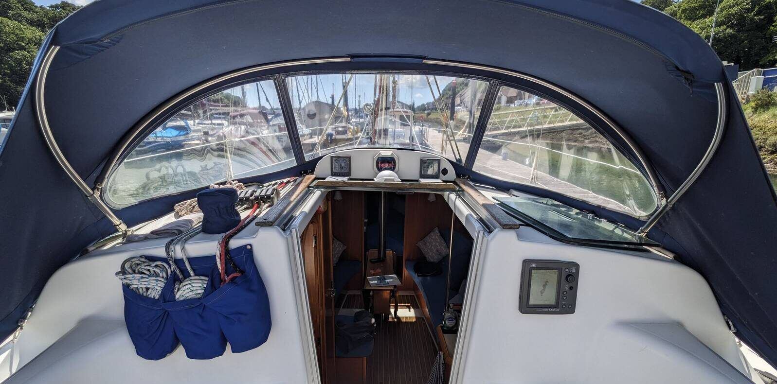 The SO's mainsheet is led from the middle of the boom to blocks on the coachroof, an arrangement that keeps the cockpit uncluttered but compromises fine mainsail tuning. Courtesy of Yachts.co