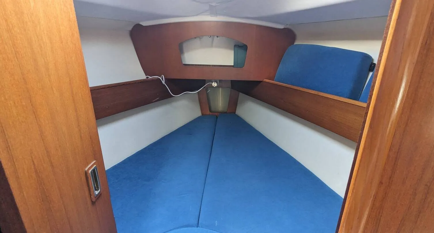 The forward cabin's bi-fold door provides adequate space for dressing, with 6-ft. 2-in. of headroom and a berth measuring 6-ft. 1-in. on the centerline. Courtesy of Yachts.co
