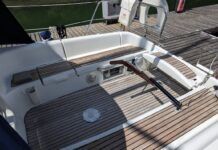 The Sun Odyssey 32's tiller steering is a notable feature for a 32-ft. cruising boat. It allows for easy movement forward and aft in the cockpit and the ability to lift the tiller completely out of the way when the boat is at rest. This opens the cockpit entirely—a trade-off for the loss of a central pedestal that would otherwise house instruments and controls. Courtesy of Yachts.co