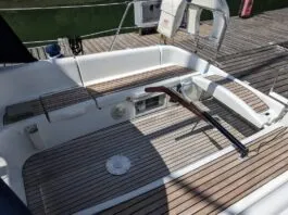 The Sun Odyssey 32's tiller steering is a notable feature for a 32-ft. cruising boat. It allows for easy movement forward and aft in the cockpit and the ability to lift the tiller completely out of the way when the boat is at rest. This opens the cockpit entirely—a trade-off for the loss of a central pedestal that would otherwise house instruments and controls. Courtesy of Yachts.co