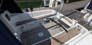 The Sun Odyssey 32's tiller steering is a notable feature for a 32-ft. cruising boat. It allows for easy movement forward and aft in the cockpit and the ability to lift the tiller completely out of the way when the boat is at rest. This opens the cockpit entirely—a trade-off for the loss of a central pedestal that would otherwise house instruments and controls. Courtesy of Yachts.co