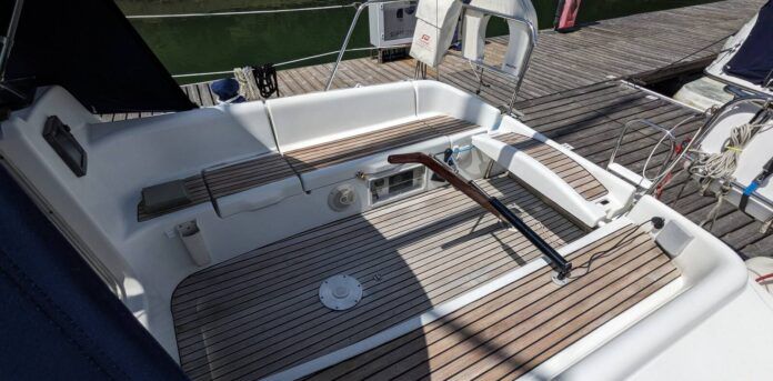 The Sun Odyssey 32's tiller steering is a notable feature for a 32-ft. cruising boat. It allows for easy movement forward and aft in the cockpit and the ability to lift the tiller completely out of the way when the boat is at rest. This opens the cockpit entirely—a trade-off for the loss of a central pedestal that would otherwise house instruments and controls. Courtesy of Yachts.co