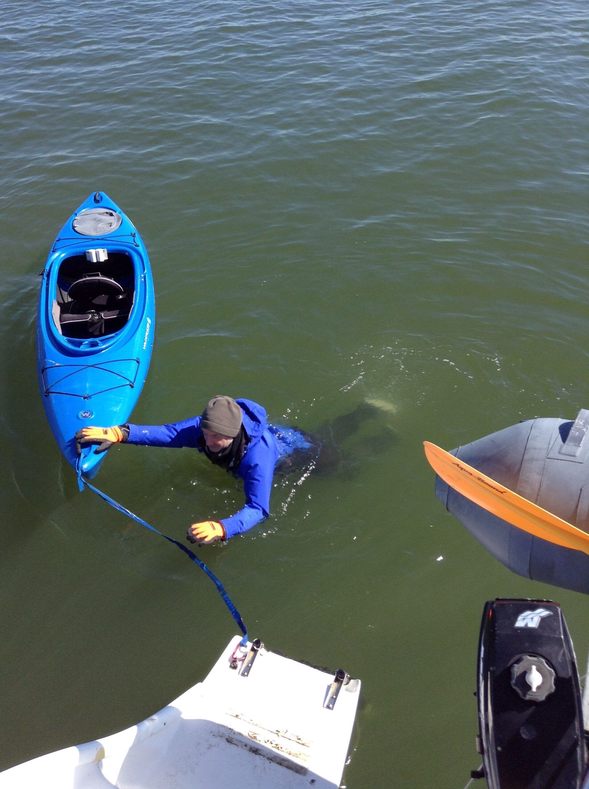 It is easy to swim in a dry suit. Not only can you board a dinghy, you can also re-board a kayak. That would be impossible in an immersion suit. (Photo/ Drew Frye)