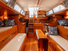 Hinckley Bermuda 40 Used Boat Review Pilot berths flanking extension settees create four sleeping berths, though the layout pushes furniture toward centerline—a tradeoff for the wide sidedecks that enhance safety. Courtesy of YachtWorld.com