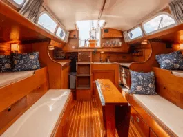 Pilot berths flanking extension settees create four sleeping berths, though the layout pushes furniture toward centerline—a tradeoff for the wide sidedecks that enhance safety. Courtesy of YachtWorld.com