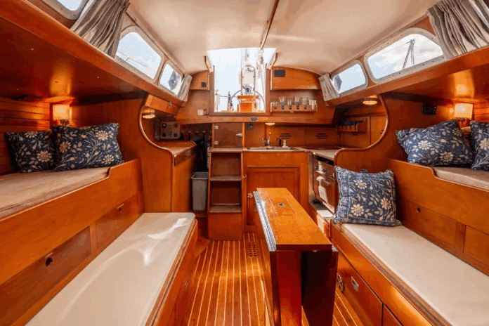 Pilot berths flanking extension settees create four sleeping berths, though the layout pushes furniture toward centerline—a tradeoff for the wide sidedecks that enhance safety. Courtesy of YachtWorld.com