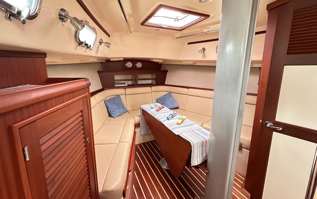 The Estero's forward saloon doubles as a sleeping cabin. Placing the main social area ahead of the mast is a radical departure for Island Packet—and yields a well-ventilated, light-filled space that converts to a large berth, albeit with some effort. (Photo/ McCann Yachts)