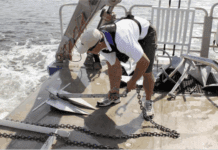 Anchors on the University of Maryland’s Rachel Carson are prepared for deployment into the Chesapeake Bay muck.