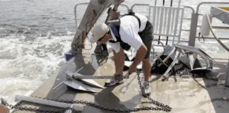 Anchors on the University of Maryland’s Rachel Carson are prepared for deployment into the Chesapeake Bay muck.