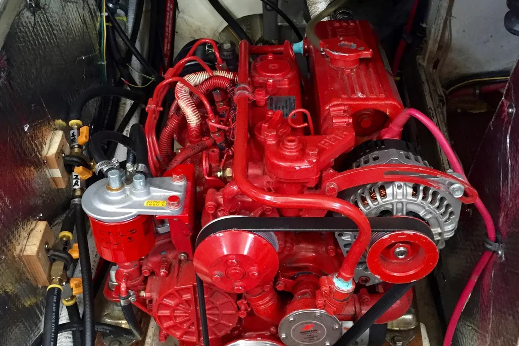 Original Volvo MD series engines are aged out, and access for service behind the companionway steps can be tight. Many owners, like the one for this listed boat, have repowered with a Beta Marine 28-hp diesel (shown), a popular upgrade that offers reliable parts availability and smoother operation than the raw-water-cooled originals. Photo courtesy of YachtWorld.com