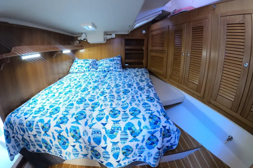 This 2005 Morgan 440's spacious aft cabin sleeps two in comfort with plenty of room to stow gear in the teak louvered lockers lining both sides. Quality joinery and thoughtful storage design make this cabin a practical retreat for long-term cruising. (Photo courtesy of YachtWorld.com)