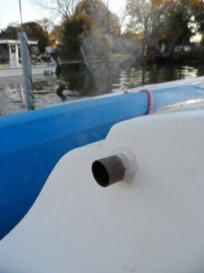 The flue is a short length of 0.75 copper pipe passing through the bulkhead. A waft of steam confirms that it is not very hot. (Photo/ Drew Frye)