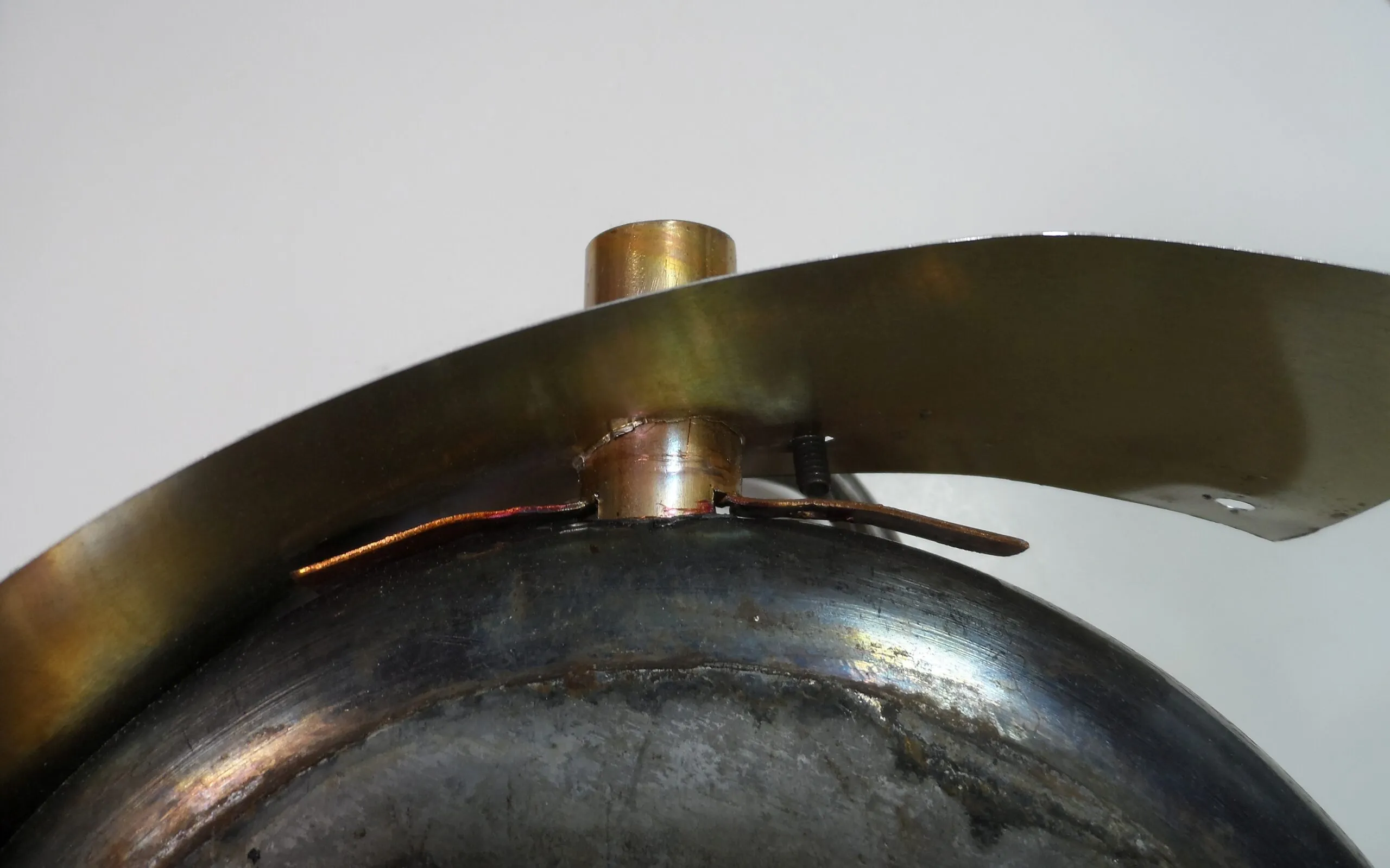 Pot heater. Copper stack fitting attached by slotting and screws. (Photo/ Drew Frye)