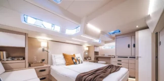 The palatial master cabin beckons with light oak joinery and hanging storage that makes you forget you're on the water.(Photo courtesy of YachtWorld.com)