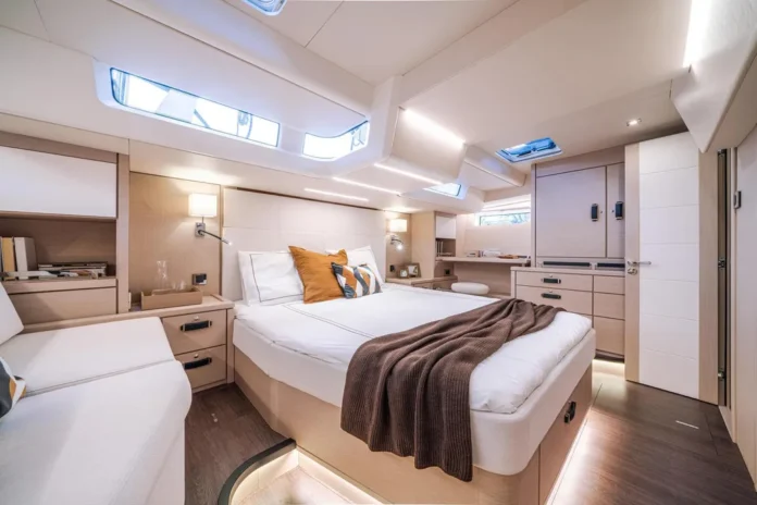 The palatial master cabin beckons with light oak joinery and hanging storage that makes you forget you're on the water.(Photo courtesy of YachtWorld.com)