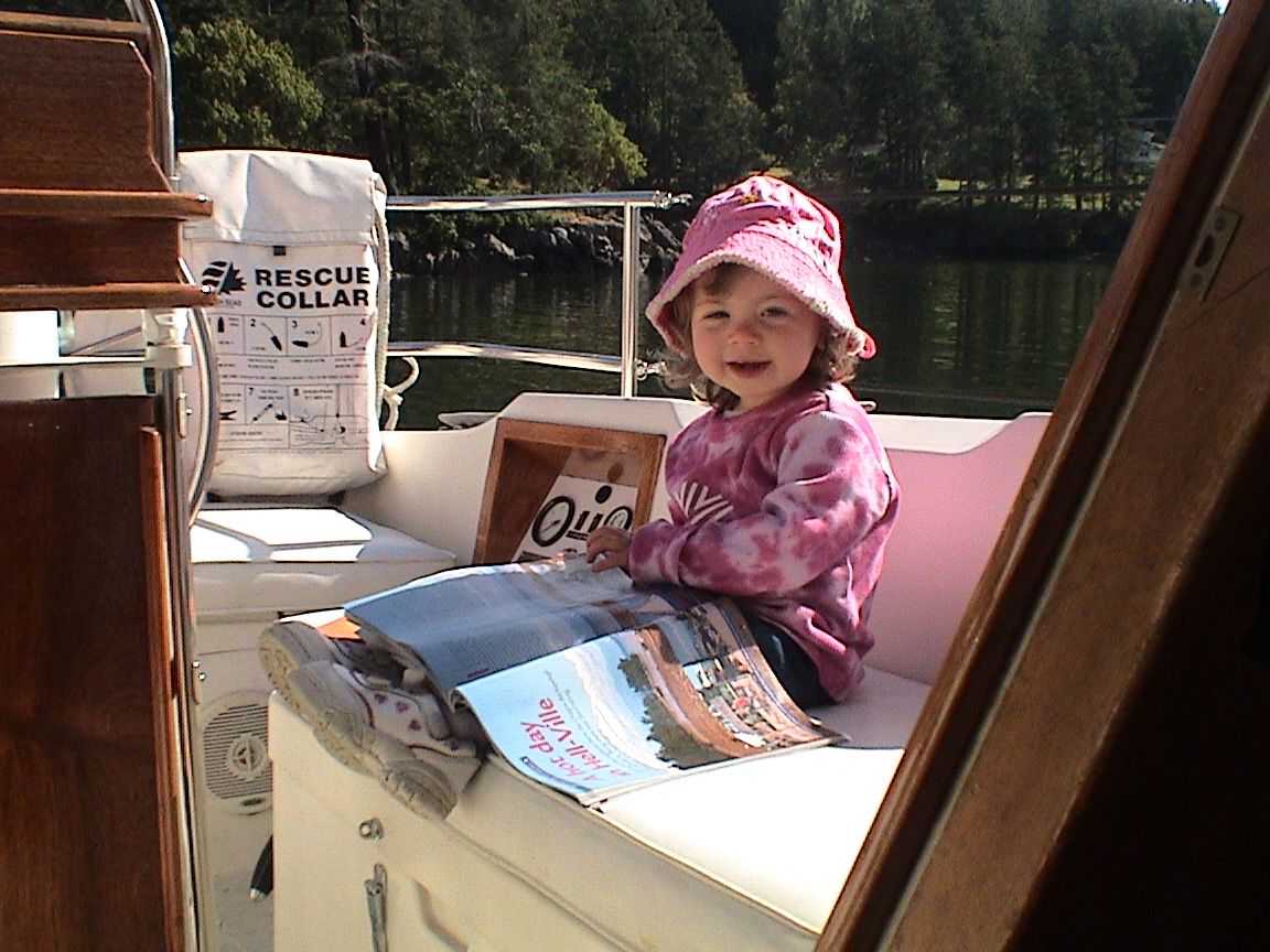 Natasha, two years old and already getting into the sailing literature. 
