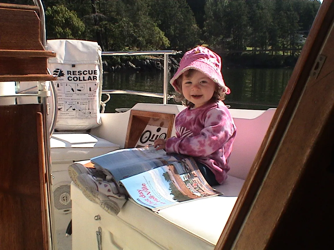Natasha, two years old and already getting into the sailing literature.