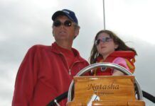 Old Boats, New Generations: The Real Value of Our Cruising Life Author Bert Vermeer and his granddaughter Natasha, age 8, at the helm.
