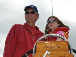 Author Bert Vermeer and his granddaughter Natasha, age 8, at the helm.