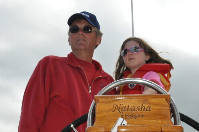 Author Bert Vermeer and his granddaughter Natasha, age 8, at the helm.
