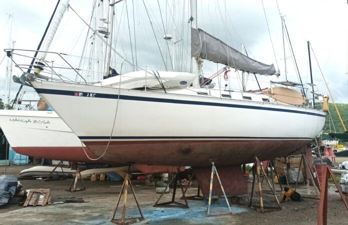 During the survey on this CS 36 in the Dominican Republic, the author found widespread moisture, hidden core rot, and structural concerns beneath her freshly painted topsides.(Photo/ Ray Ville)