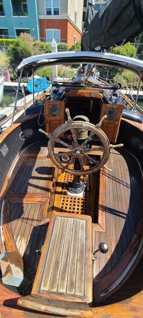 The Union 36's snug cockpit has high coamings and a small footwell drained by two 1-in. scuppers. Its a cozy atmospheric in contrast to today's more sterile fiberglass cockpits. (Photo/ Seattle Yachts)