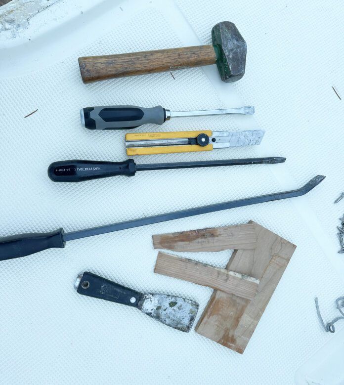 Tools required to remove the hatch from the deck include.