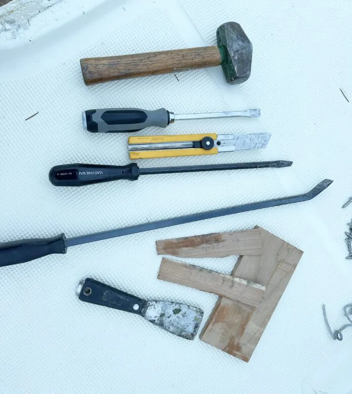 Tools required to remove the hatch from the deck include.