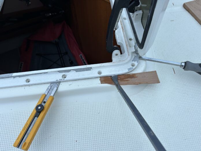 prying edge of hatch up for refurbishment