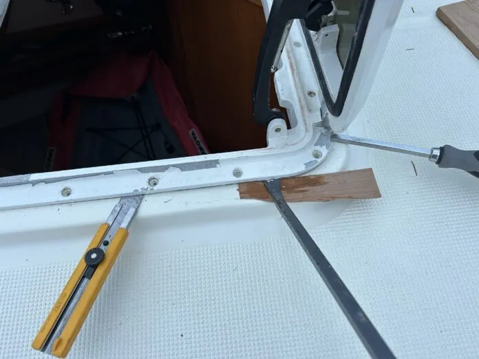 prying edge of hatch up for refurbishment