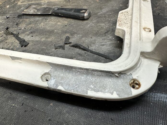 sandblast loose paint on hatch