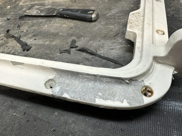 sandblast loose paint on hatch