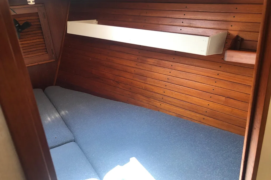 The forward berths are long enough, but they pinch together so tightly at the foot that two tall sleepers will be tangling toes unless they use it as a double. (Photo courtesy of YachtWorld.com)