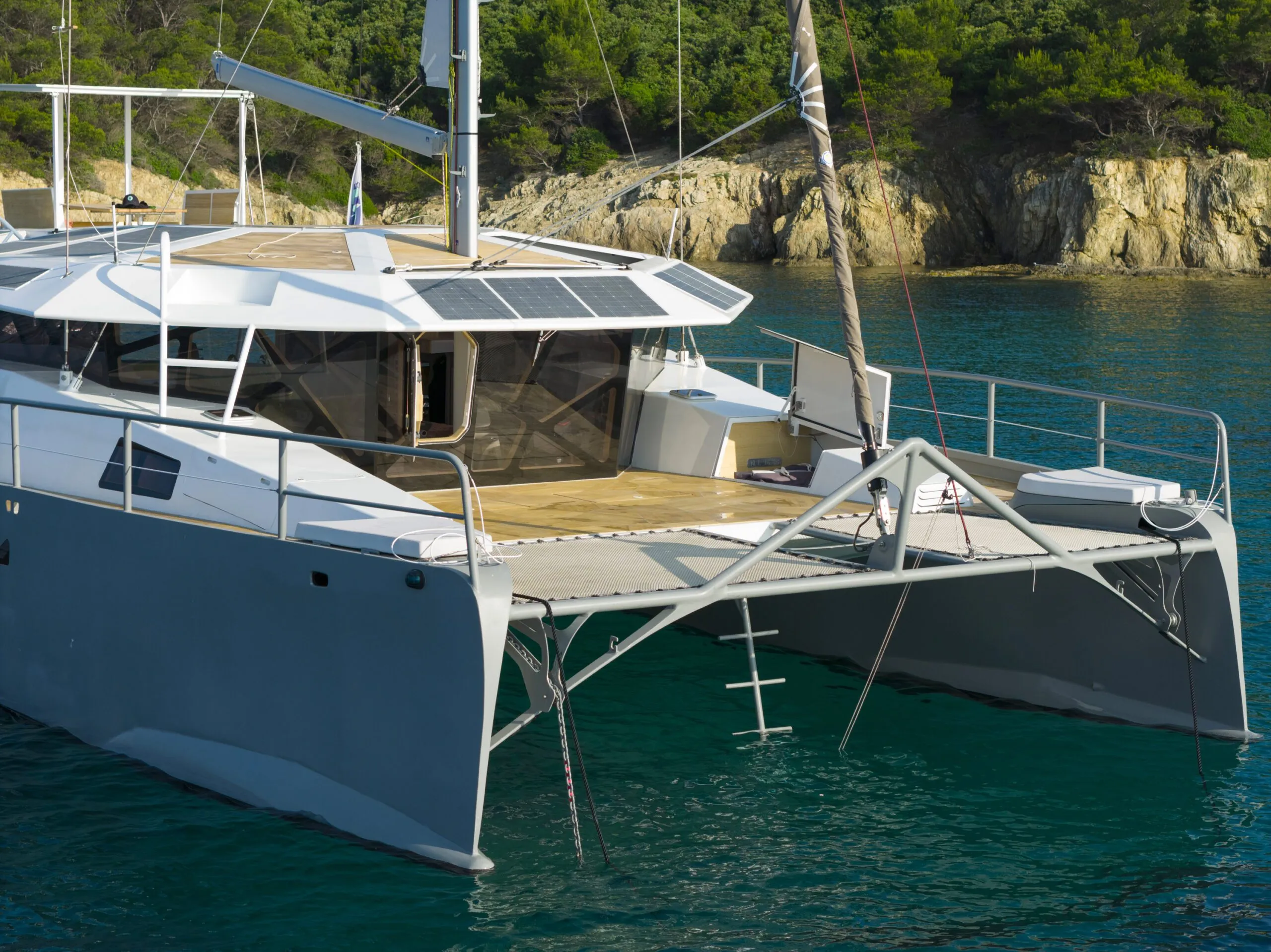 Solar panels line the coach roof from bow to stern, feeding a 65-kW lithium battery bank that powers the hybrid propulsion system. 