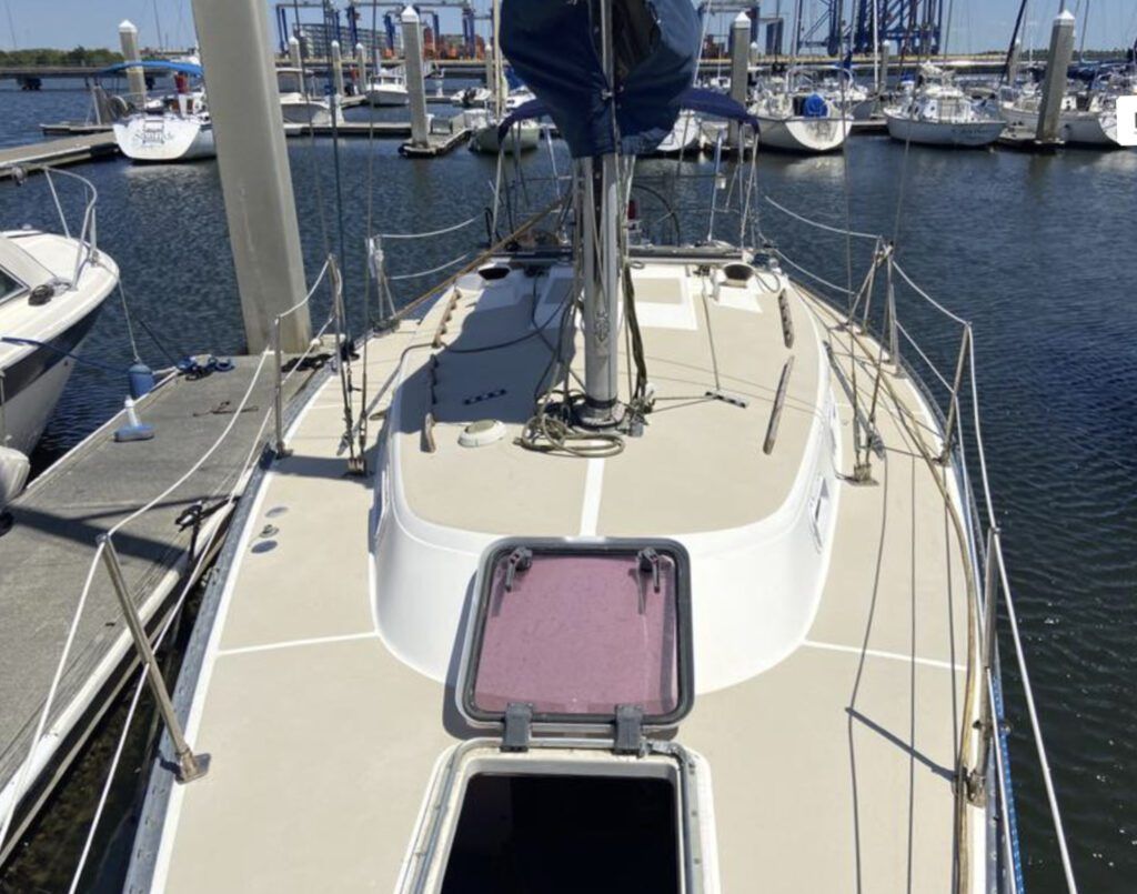 Wide side decks and inboard shrouds make it easy to work the foredeck when setting or dousing headsails. The two-tone deck keeps glare in check and gives some visual relief to an otherwise plain-vanilla exterior. (Photo courtesy of YachtWorld.com)