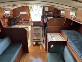 The port-side settee is less than 5 ft. long, making it a child's berth at best. Outboard of it, a narrow pilot berth is comfortable and secure, and mercifully isn't jammed up under the side decks. (Photo courtesy of SailboatListings.com)
