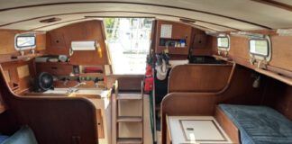 The port-side settee is less than 5 ft. long, making it a child's berth at best. Outboard of it, a narrow pilot berth is comfortable and secure, and mercifully isn't jammed up under the side decks. (Photo courtesy of SailboatListings.com)