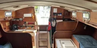 The port-side settee is less than 5 ft. long, making it a child's berth at best. Outboard of it, a narrow pilot berth is comfortable and secure, and mercifully isn't jammed up under the side decks. (Photo courtesy of SailboatListings.com)