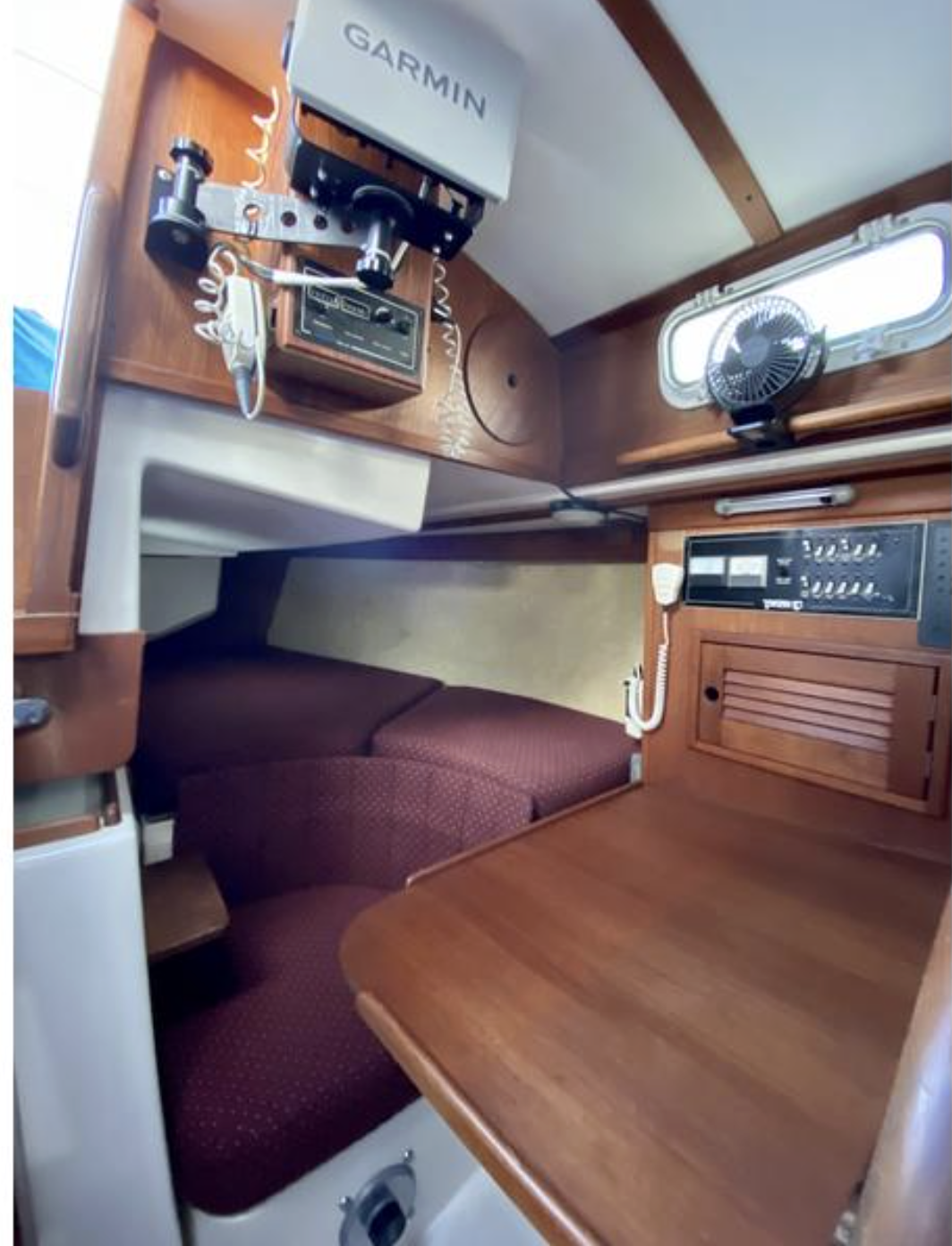 The big quarterberth makes good use of space aft of the nav station. Electronics live overhead and outboard, but there’s still just enough room to spread a paper chart. (Photo courtesy of SailboatListings.com)